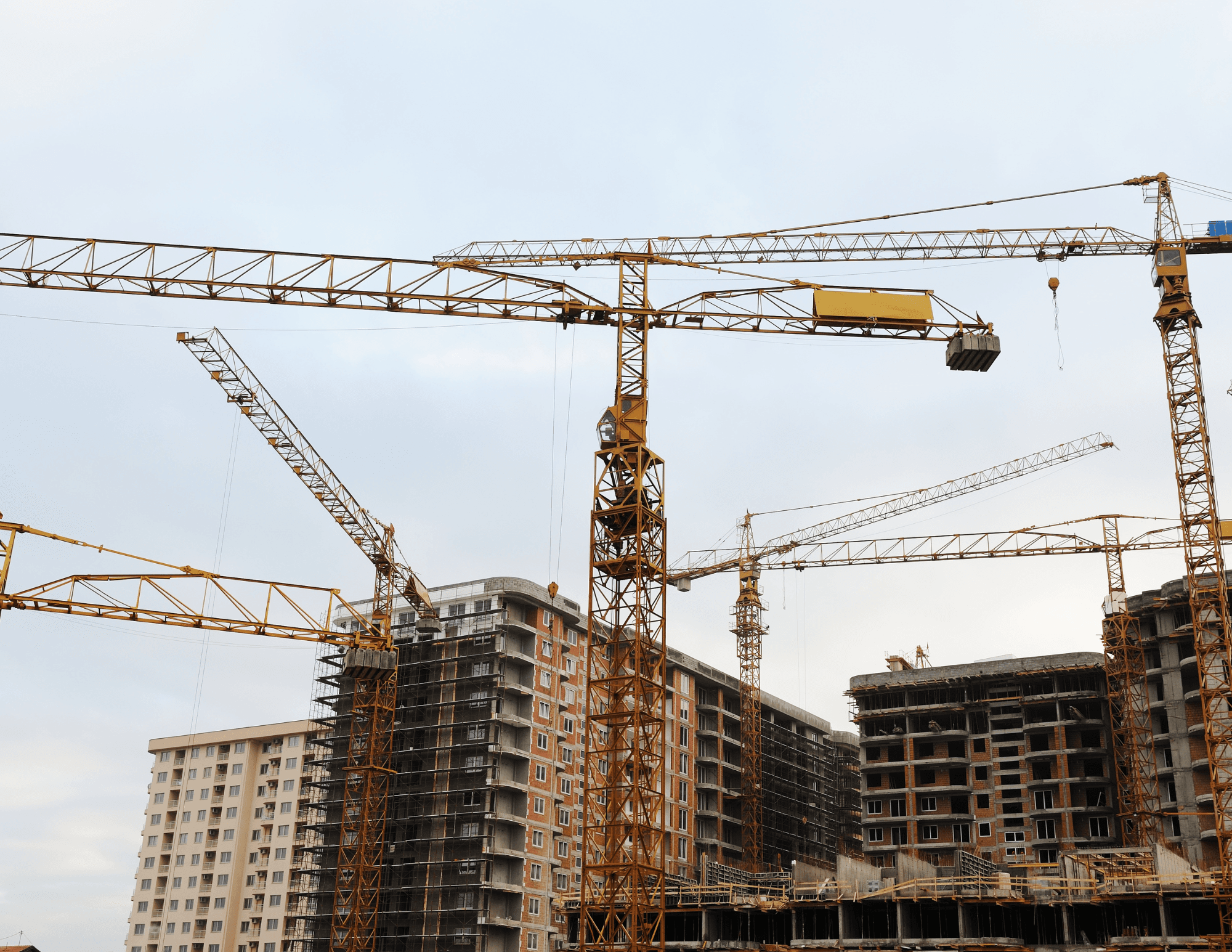 Construction cranes at development site